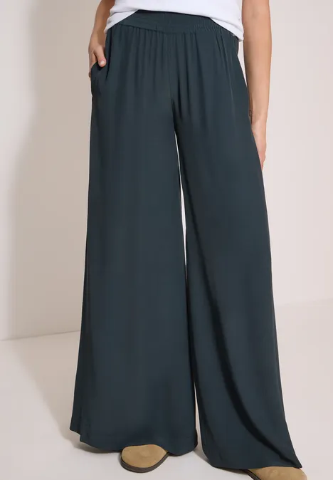 High Waist Wide Leg Hose im Loose Fit palm breeze green Schwarze, weite Damenhose mit elastischem Bund und Taschen.