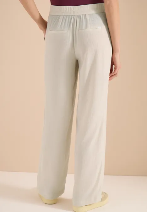 High Waist Straight Leg Hose im Loose Fit grain beige Beige, locker sitzende, weite Damenhose mit elastischem Bund und aufgesetzten Gesäßtaschen.