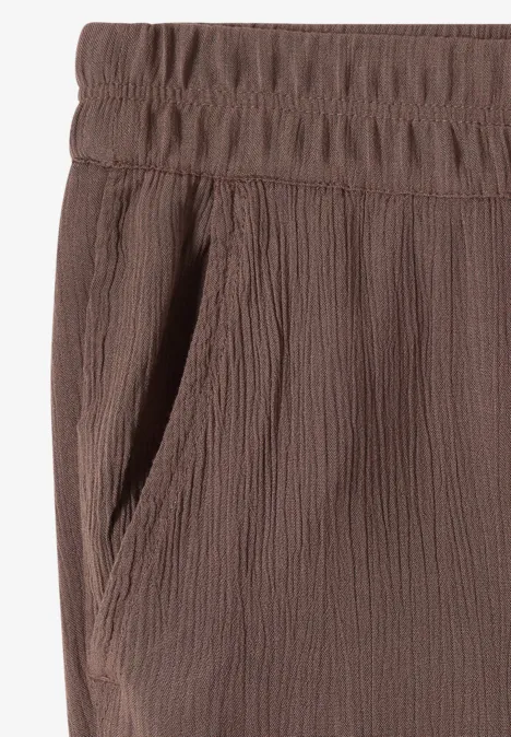 Bruine broek met elastische taille, gestructureerde stof en zijzak.