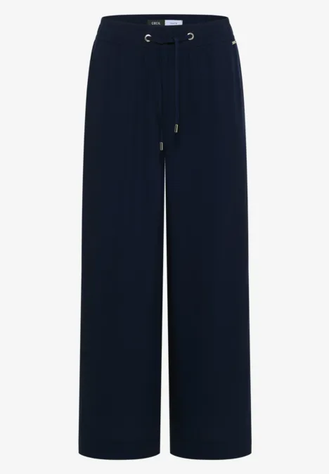 Dunkelblaue, weite Hose mit elastischem Bund und Kordelzug.
