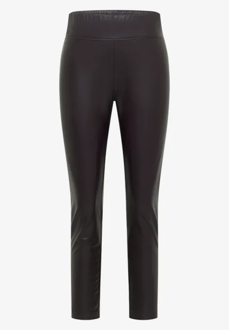 Schwarze, schmale, knöchellange Leggings aus glänzendem Material mit hohem Bund.