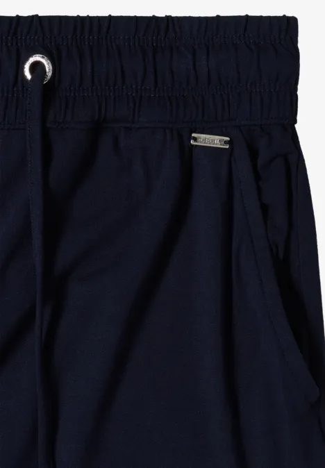 Diepblauwe joggingbroek met elastische taille, trekkoord en steekzakken.