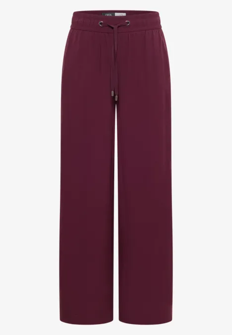 Burgunderrote, locker geschnittene Stoffhose mit hohem Bund und Tunnelzug, weitem Bein.