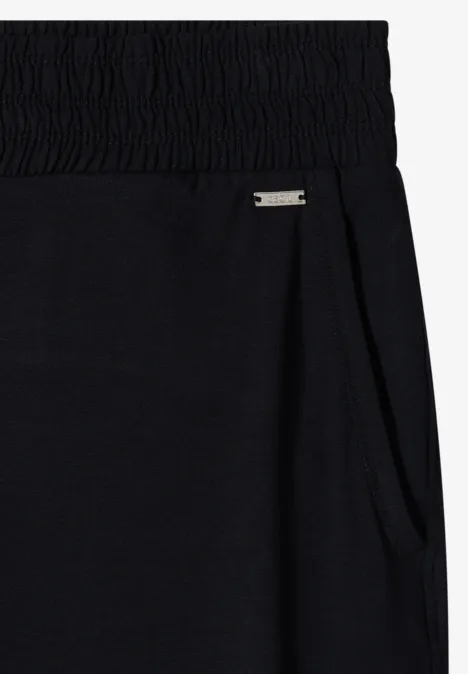 Zwarte joggingbroek met elastische taille, zijzak en klein metalen logo.