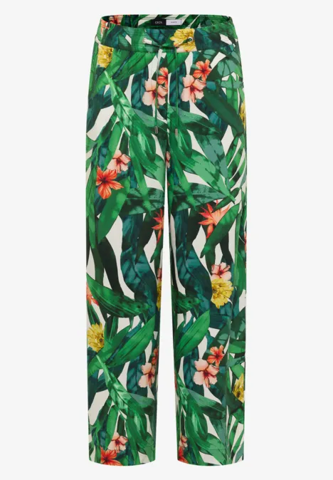 High Waist Wide Leg Hose im Loose Fit khaki Weite Hose mit tropischem Blumen- und Blattmuster in Grün, Weiß und Rot.