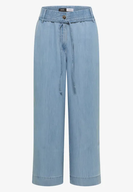 Hellblaue, weite Jeanshose mit hoher Taille, Kordelzug und geradem Bein.