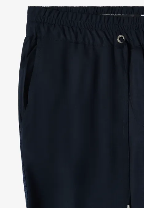 Wide Leg Hose mit tonalem Tape-Detail universal blue Dunkelblaue Jogginghose mit elastischem Bund und seitlichen Eingrifftaschen.