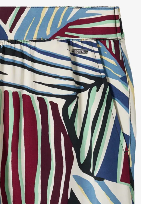 Gemusterter Wickelrock mit farbigen Streifen in Blau, Grün und Burgund auf weißem Grund.