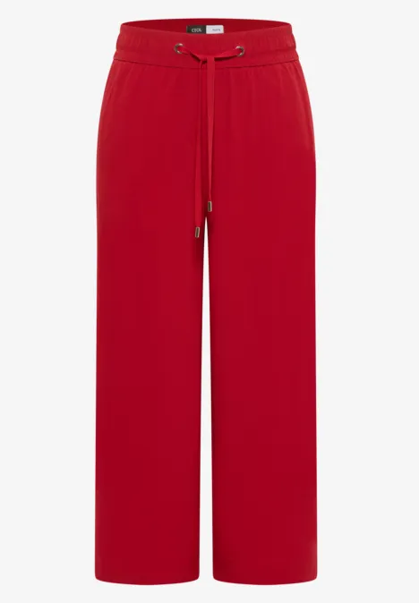 Rote, weite Hose mit elastischem Bund und Tunnelzug, locker geschnitten.