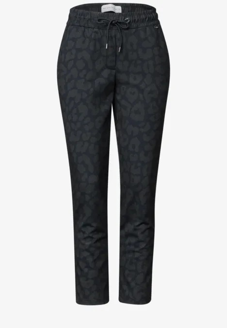 Pantalon noir décontracté à cordon de serrage, motif léopard discret, longueur cheville.