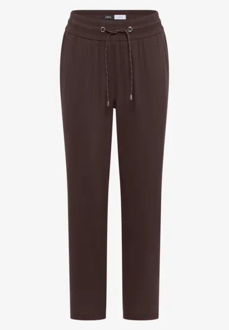 Bruine joggingbroek met koord in de taille, elastische boorden en rechte pasvorm.