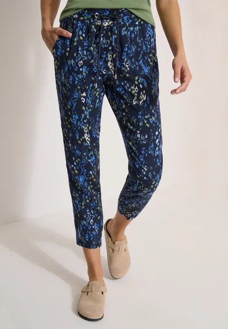 Pantalon femme confortable avec imprimé floral bleu-vert, taille haute, jambes fuselées et cordon de serrage.
