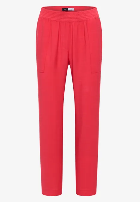 Rote Damenhose mit elastischem Bund und geradem Schnitt.
