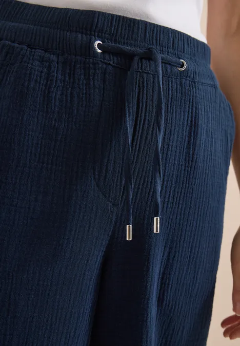 Pantalon en coton bleu foncé avec cordon de serrage à la taille