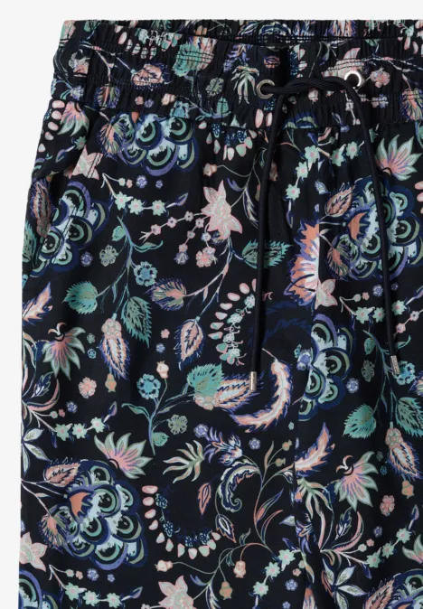 Navyblaue Stoffhose mit buntem, verspieltem Blumenmuster und elastischem Bund mit Kordel