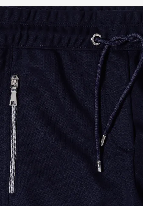 Pantalon de jogging bleu marine avec cordon de serrage et poche zippée.