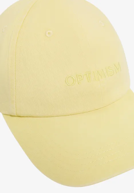Katoenen pet met borduursel butter yellow