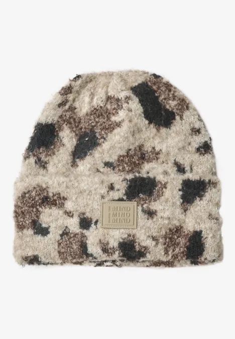 Bonnet en fausse fourrure à motif vache pearl beige mel. Bonnet en fausse fourrure à motif vache pearl beige mel.