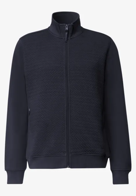 Dunkelblaue, gesteppte Jacke mit Reißverschluss, Stehkragen, langen Ärmeln und Seitentaschen.