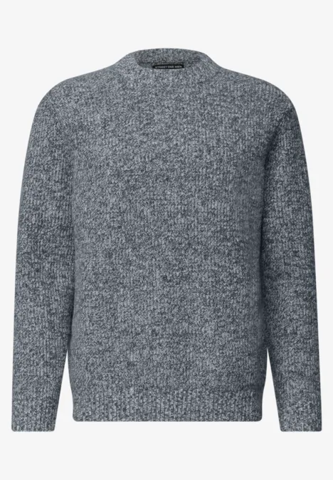 Grauer Rundhals-Pullover aus weichem Strick mit langen Ärmeln.
