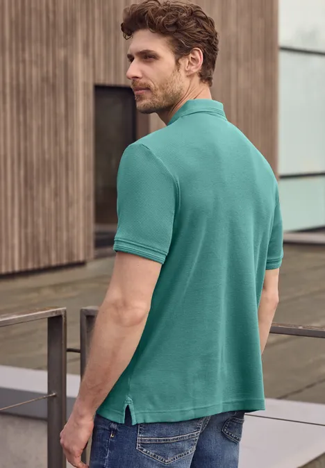 Polo zippé et structuré caribbean green