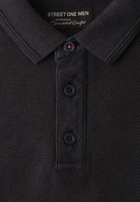 Polo homme noir texturé, patte de boutonnage et étiquette "Street One Men".