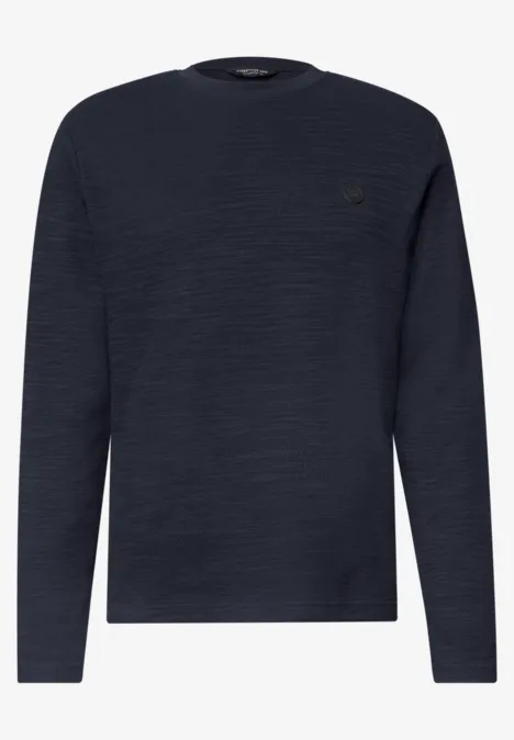 Pull à manches longues bleu marine avec texture discrète et encolure ronde.