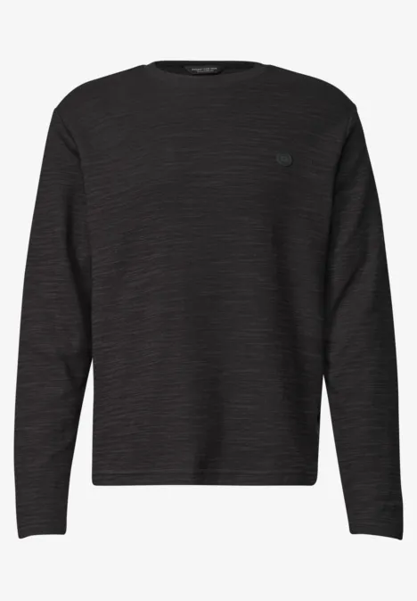 Langarm Shirt mit Rundhals in Unifarbe basic black Schwarzer Pullover mit Rundhalsausschnitt und langen Ärmeln.