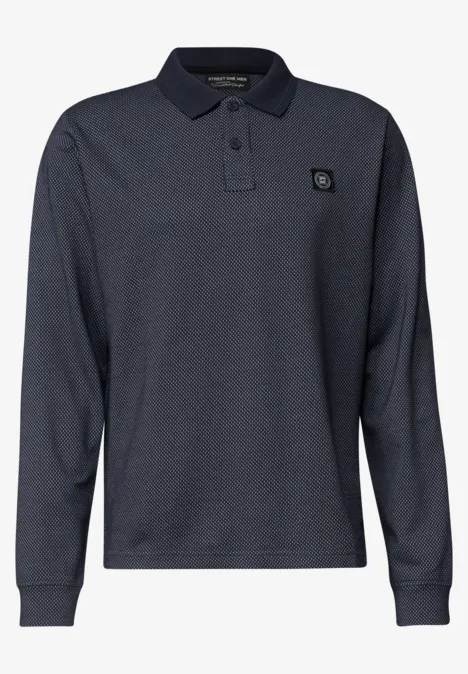 Polo à manches longues bleu foncé en piqué de coton, col classique, patte de boutonnage et petit logo poitrine.