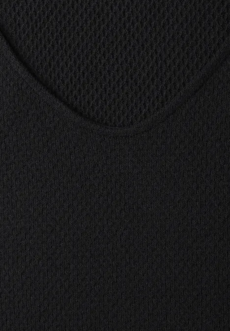 Nahaufnahme eines schwarzen Mesh-Stoffes mit feinem Gittermuster.
