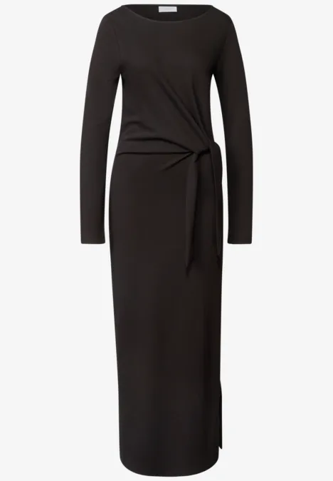 Schwarzes, langärmeliges Midikleid mit seitlichem Knotendetail und figurbetonter Passform.