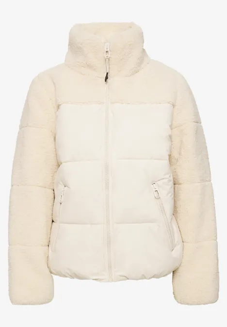 Veste matelassée blanc cassé, manches en fausse fourrure et col montant.