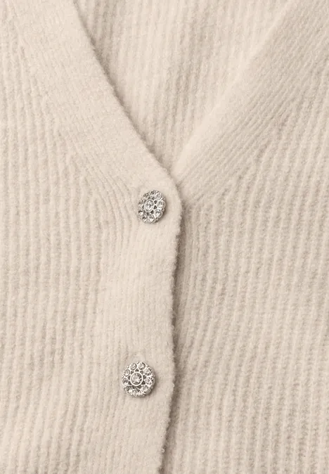 Cardigan mit V-Neck und Knopfleiste creamed sand mel. Beige gestricktes Cardigan mit glitzernden Strassknöpfen.