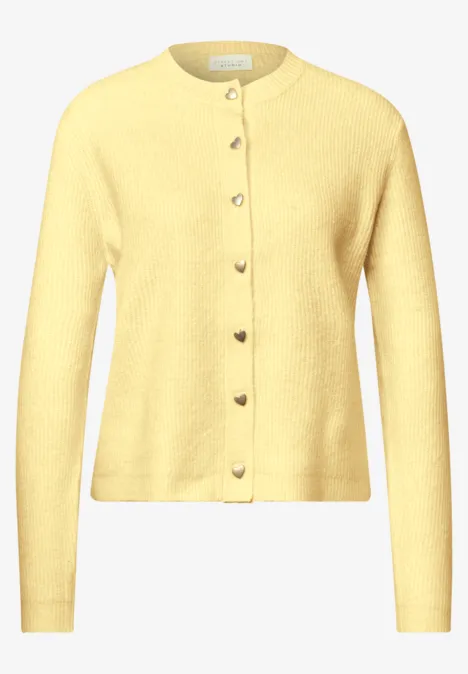 Cardigan à côtes et col rond healing yellow mel. Gelbe Strickjacke mit Rundhalsausschnitt und durchgehenden Knöpfen