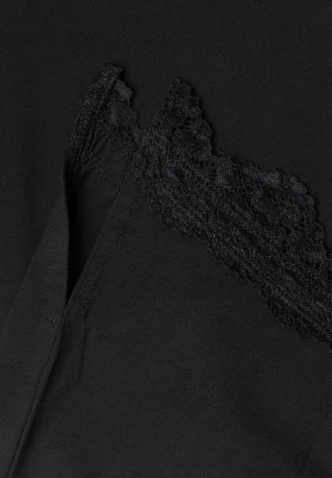 Schwarzes Spitzen-Bustier aus leichtem, transparentem Stoff mit zarter Spitze am Ausschnitt.