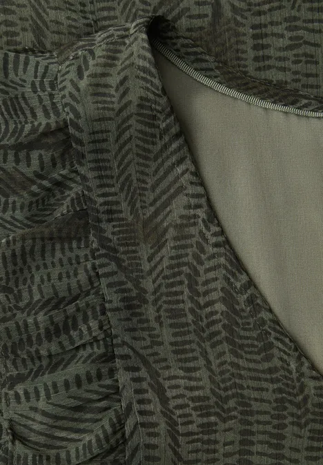 Top col V en mousseline de soie avec volants oil green