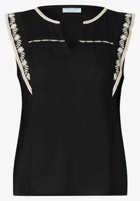 Blusentop mit Split Neck und Embroidery Black Ärmellose schwarze Bluse mit V-Ausschnitt und weißen Stickereien an Schultern und Ausschnitt