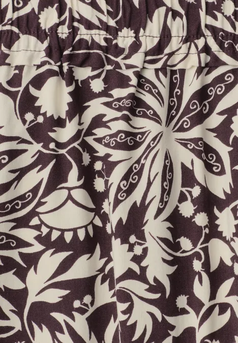 Midi-Rock mit Volants und Print very berry Beiges Stoffmuster mit schwarzen, symmetrischen Blumen- und Blattornamenten.