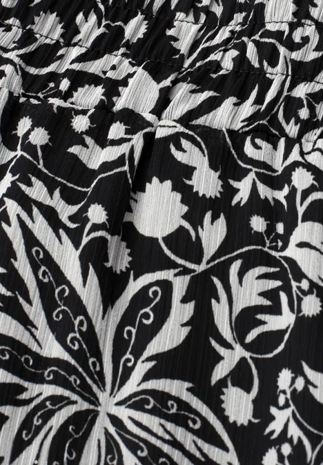 Knielange chiffonrok met volants Black Zwart-wit bloemmotief op geribd textiel
