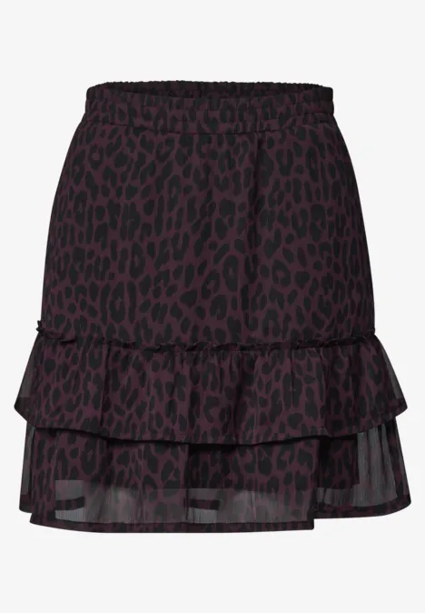 Schwarzer, mehrlagiger Minirock mit violettem Leopardenmuster und stufigem Volant.
