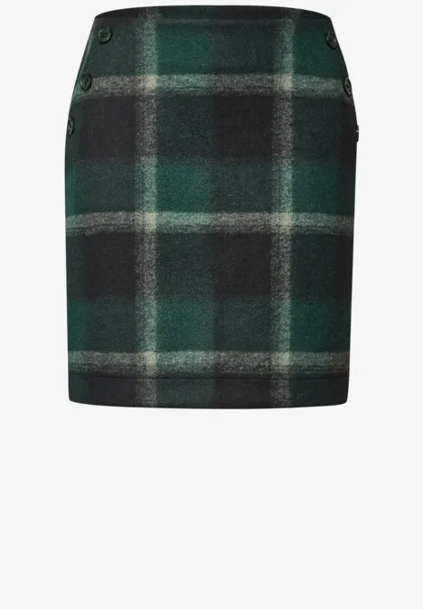 Groene mini-rok met ruitpatroon in donkergroen, zwart en grijs.