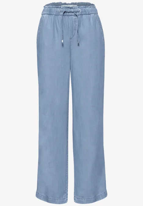 Leichte, weite Jeanshose in Hellblau mit hohem Bund und Tunnelzug.