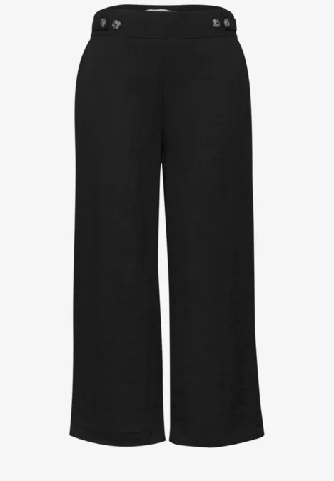 Schwarze, weite, knöchellange Damenhose mit hohem Bund.