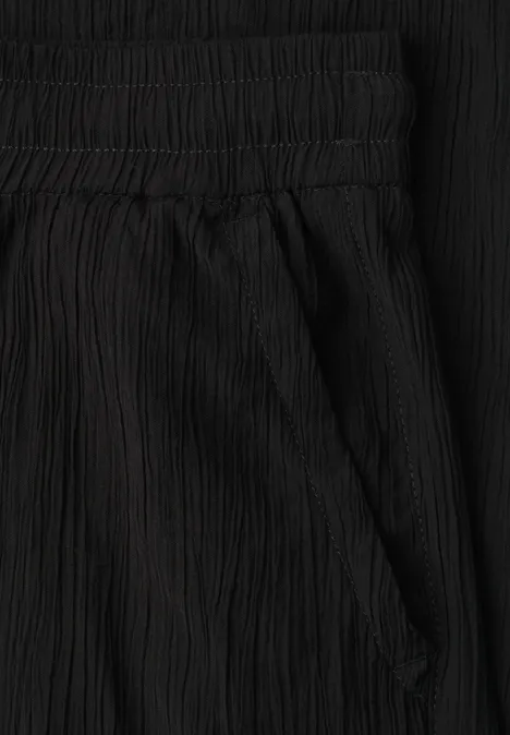 Schwarze, gekräuselte Hose mit elastischem Bund und seitlicher Tasche.