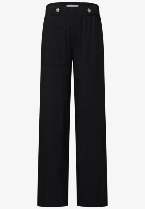 Pantalon noir ample avec taille élastique et coupe droite.