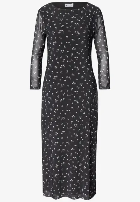 Robe midi noire ajustée à manches longues transparentes et imprimé floral blanc discret.