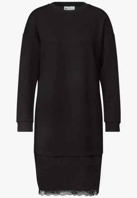 Schwarzes Sweatkleid mit langen Ärmeln und dezenter Spitze am Saum.
