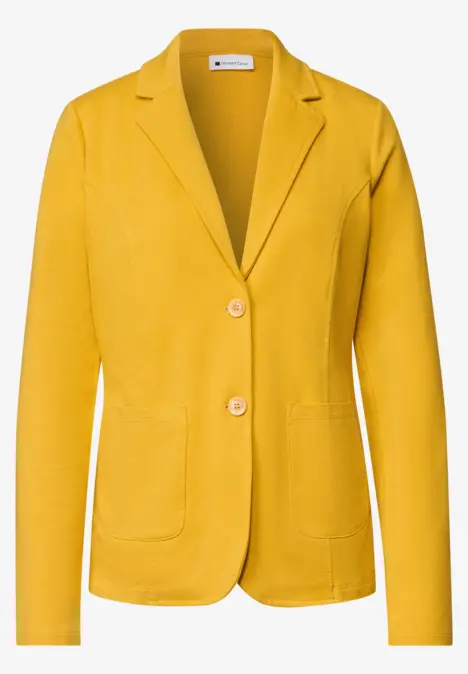 Veste femme jaune moutarde à col cranté, deux boutons et poches plaquées.