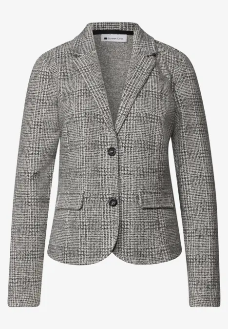 Schmal geschnittener Damenblazer mit schwarz-weißem Glencheck-Muster und zwei Knöpfen.