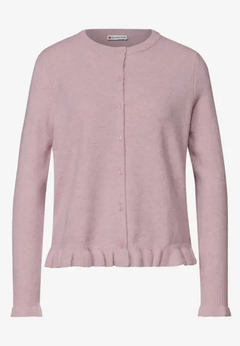 Gilet féminin rose pâle à manches longues, boutonné sur le devant et volantée au bas.